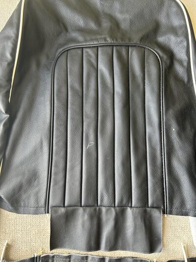TR4A pair of black with white piping leather seat covers with foam & backboards