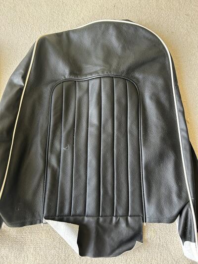 TR4A pair of black with white piping leather seat covers with foam & backboards