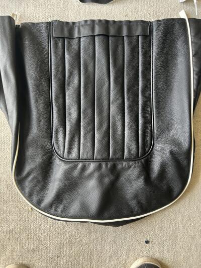 TR4A pair of black with white piping leather seat covers with foam & backboards