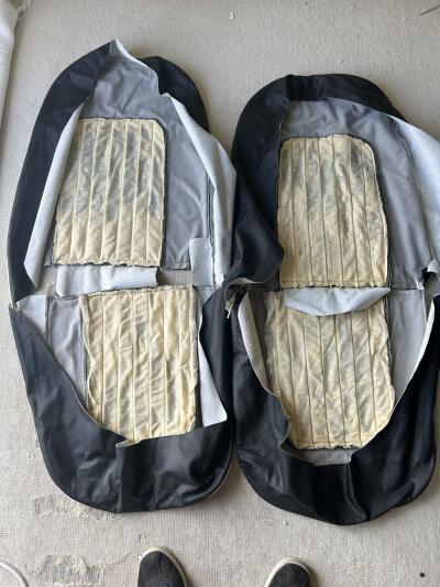 TR4A pair of black with white piping leather seat covers with foam & backboards