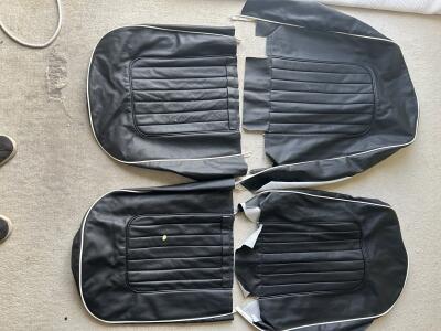 TR4A pair of black with white piping leather seat covers with foam & backboards