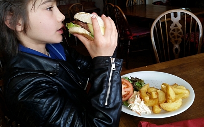 Dave Burgess's grandson tucking into a hearty burger!