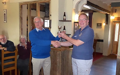 Julian Booth receives the cup on behalf of Glavon from Phil Horsley