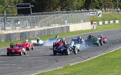 Tyre smoke at the start of the HSCC Griffiths Haig Trophy race