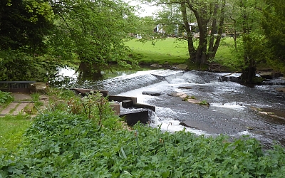 The weir for the mill leat