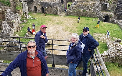 Steve and Paul from the Devon TR Group with John and Carolyn Macleod inside the chateau.